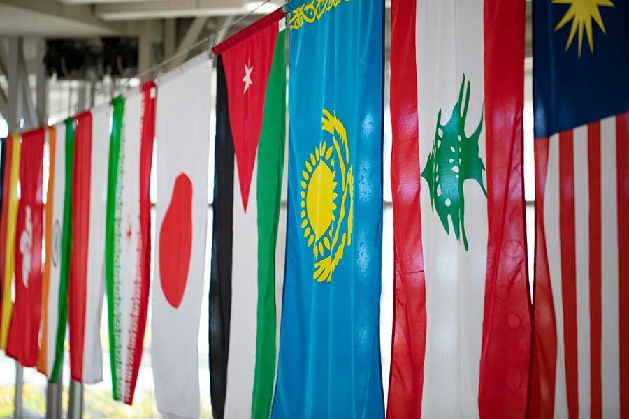 World flags hanging in UC Merced campus indoor space