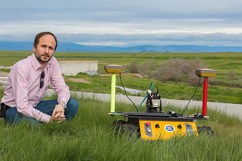 Professor Stefano Carpin and one of his robots