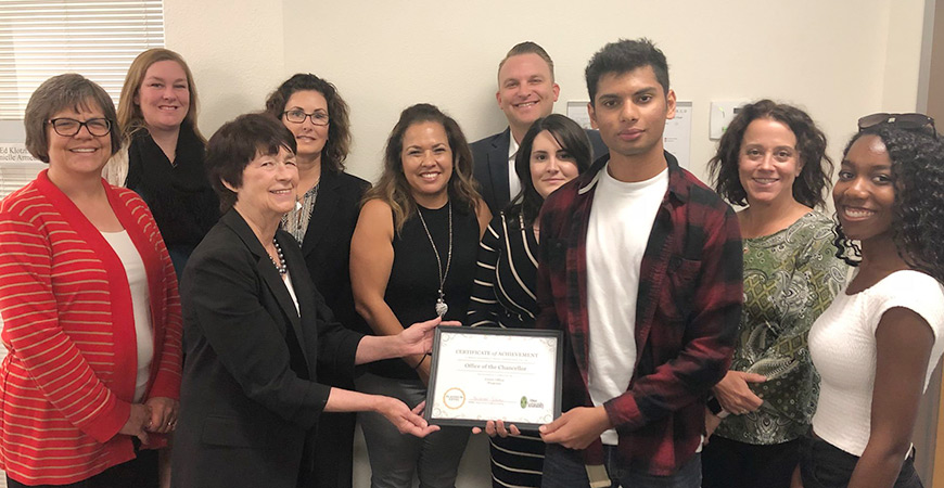 Members of the Office of the Chancellor and interns from the Green Offices program with the platinum Green Offices certification