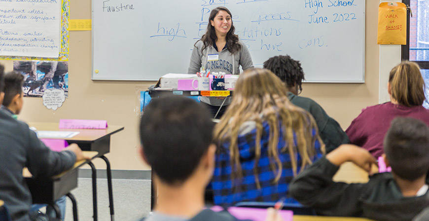 Female student addressing a classroom of high school students