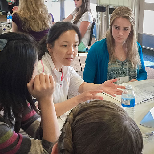 Professor Jing Xu's work in biology drew many of the girls' interest.