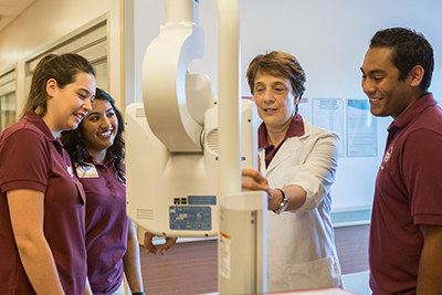 Marcee Samberg (center) works with student volunteers Rebecca Cosmero, Manjot Kaur and Salvador Ruvalcaba Sandoval.