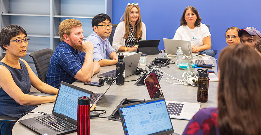 From left, UC Merced faculty Lei Yue, Keith Thompson, Changho Kim, Professor Zenaida Aguirre-Muñoz and Mayya Tokman work on planning the new calculus effort with their teammates. Photo by Jim Chiavelli