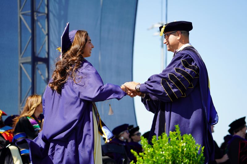 Chancellor Muñoz confers degree upon a SSHA student.
