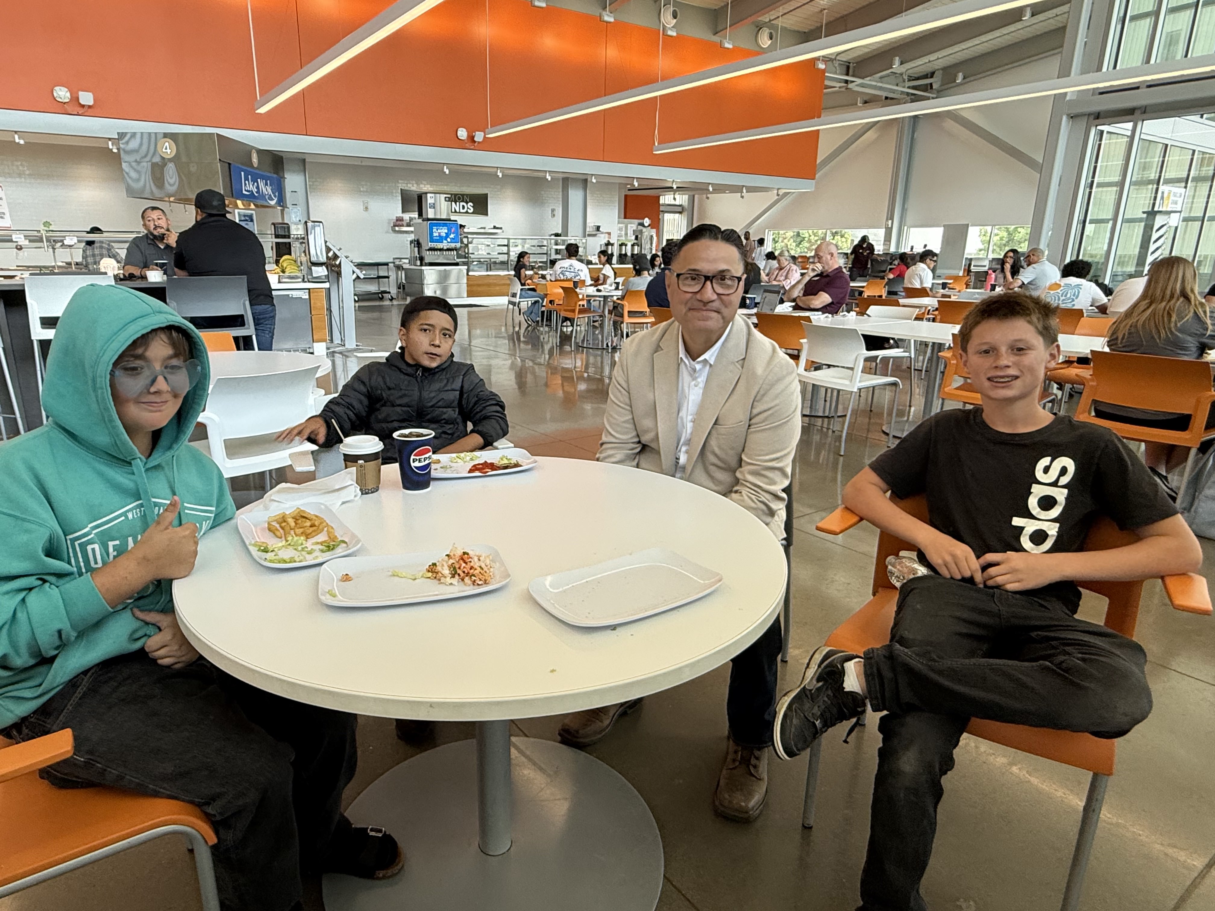Chancellor Muñoz visiting with a group of students attending our inaugural Reach for the Stars STEM Academy.